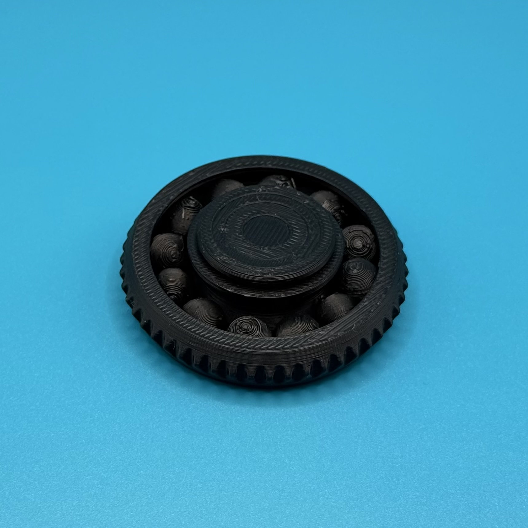 Gear-style ball spinner