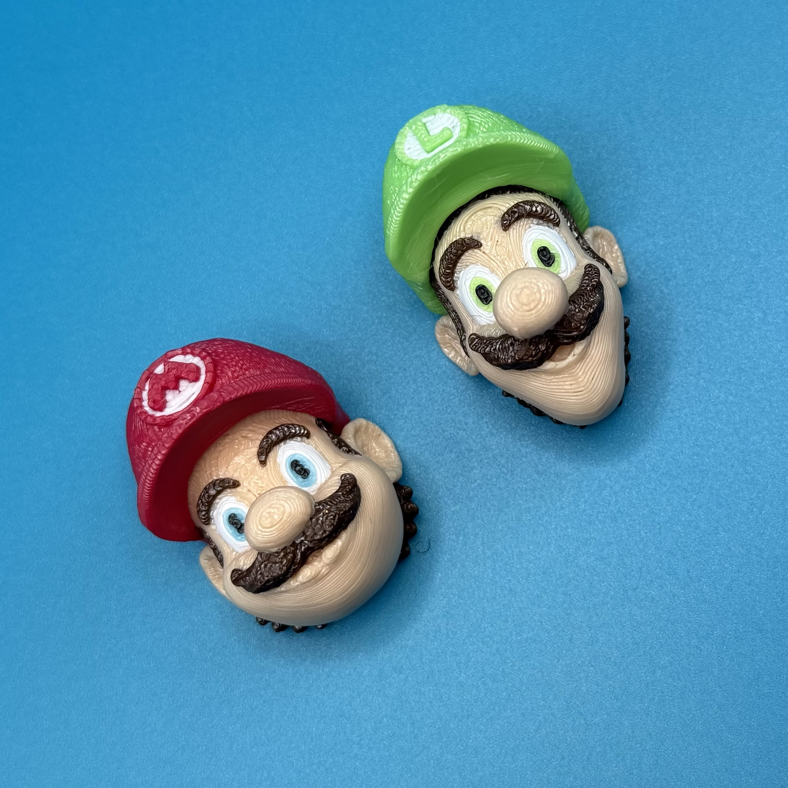 3D-printed Mario & Luigi heads