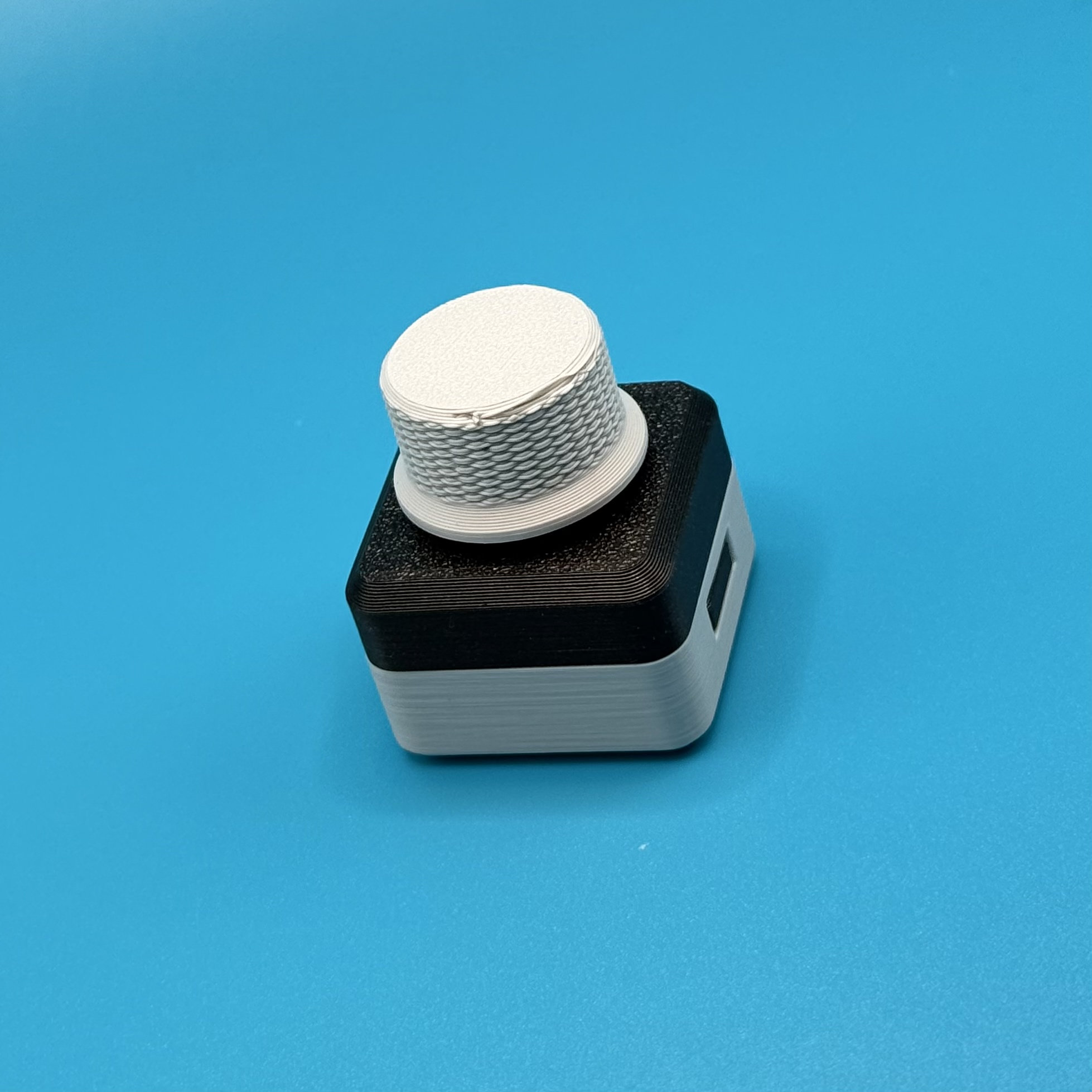 Textured dial on cube base